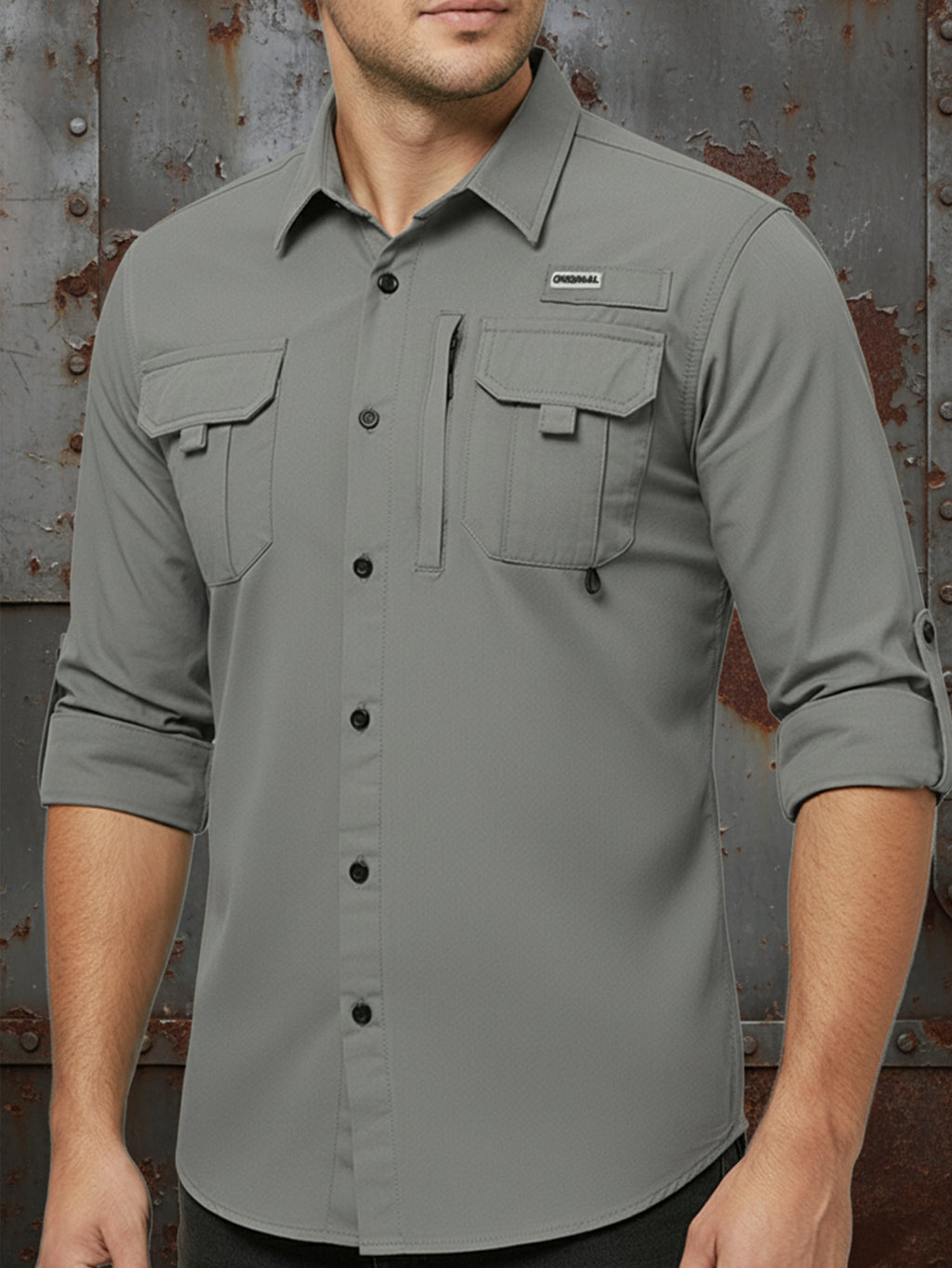 Man wearing Fredd Marshall high-performance outdoor shirt with rolled sleeves and utility pockets
