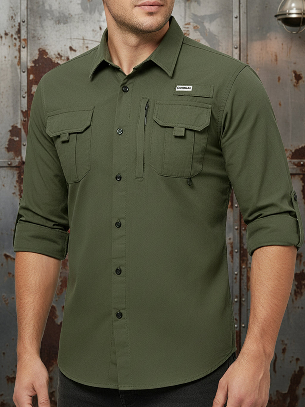 Man wearing olive green FREDD MARSHALL high-performance outdoor shirt with pockets