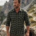 Man in high-performance outdoor plaid shirt hiking in mountains, FREDD MARSHALL apparel