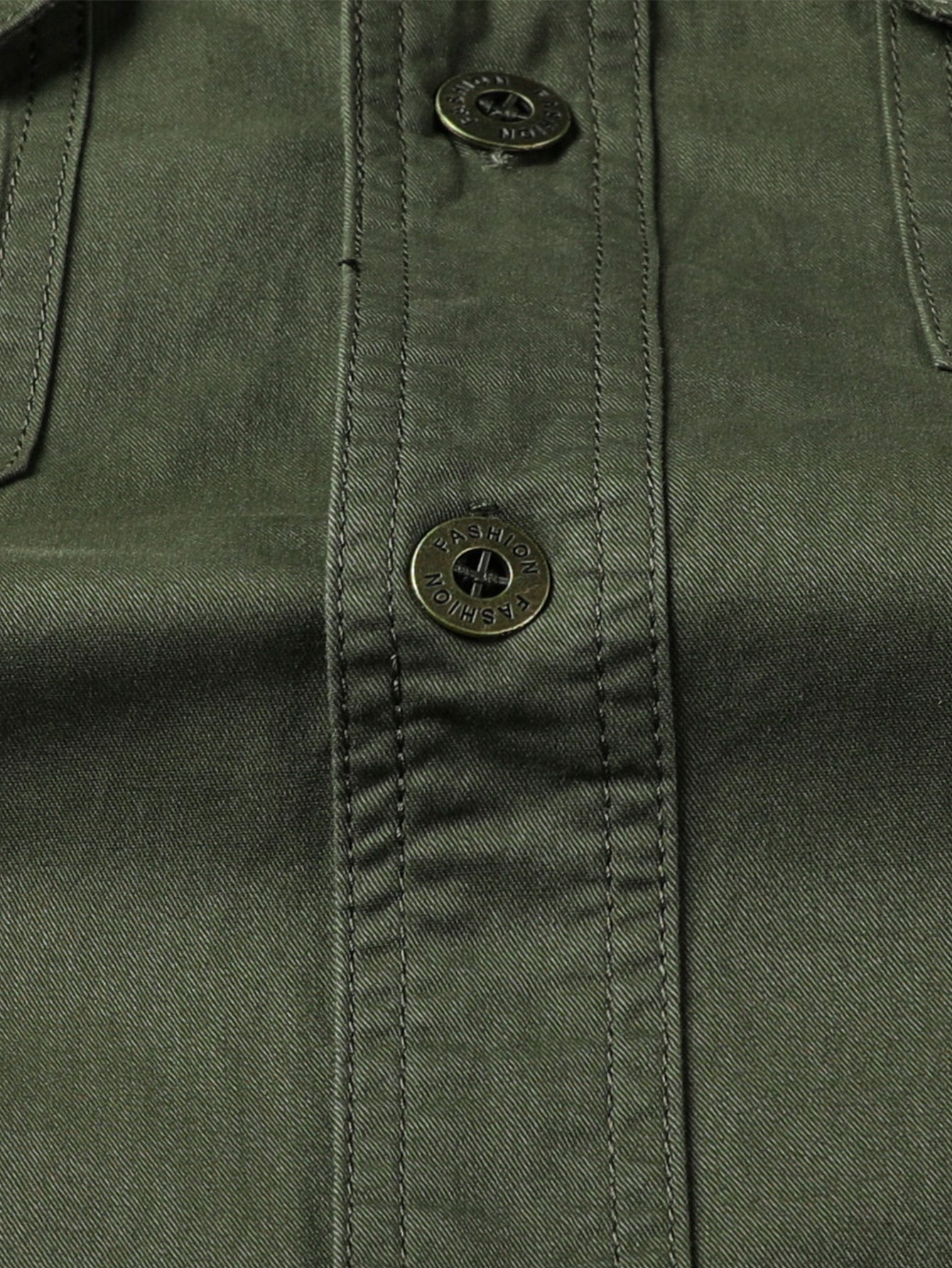 Close-up of olive green high-performance outdoor jacket with snap buttons, FREDD MARSHALL.