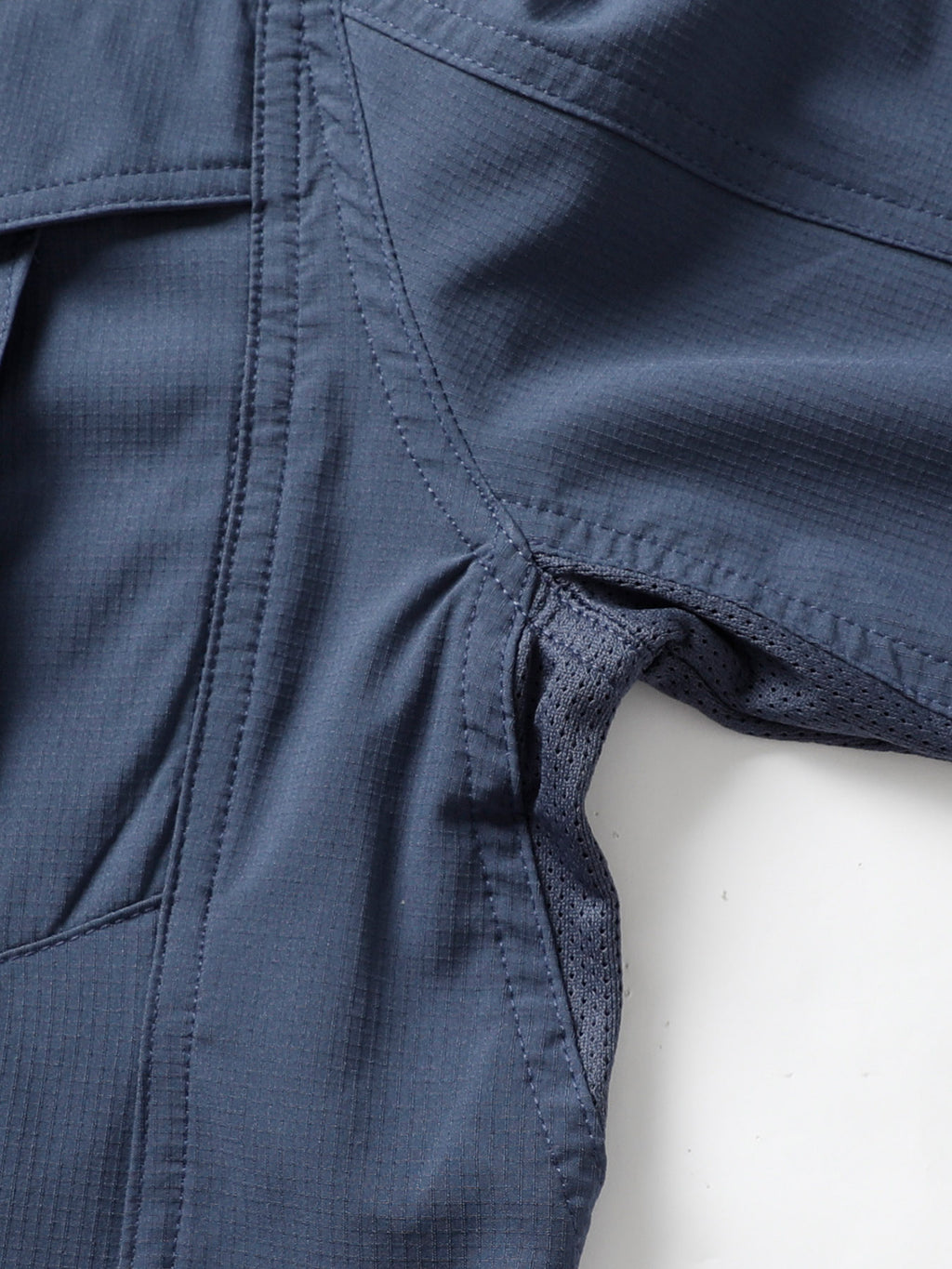 Close-up of Fredd Marshall high-performance outdoor apparel with mesh ventilation detail