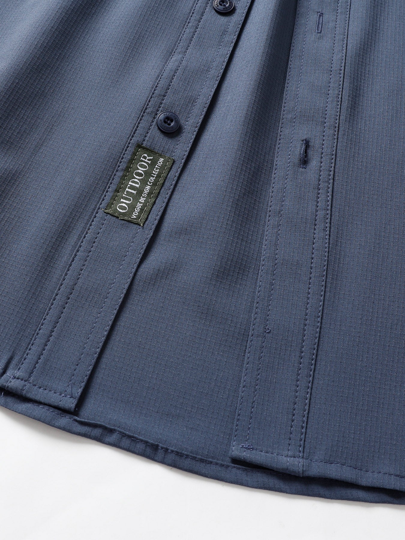 High-performance blue outdoor shirt with button detail and OUTDOOR collection label
