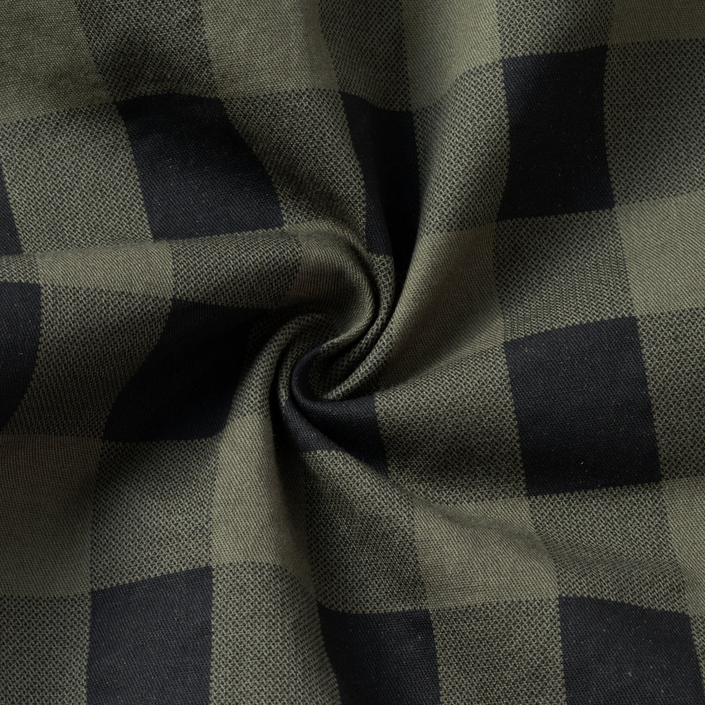 Close-up of green and black plaid high-performance outdoor apparel fabric, FREDD MARSHALL