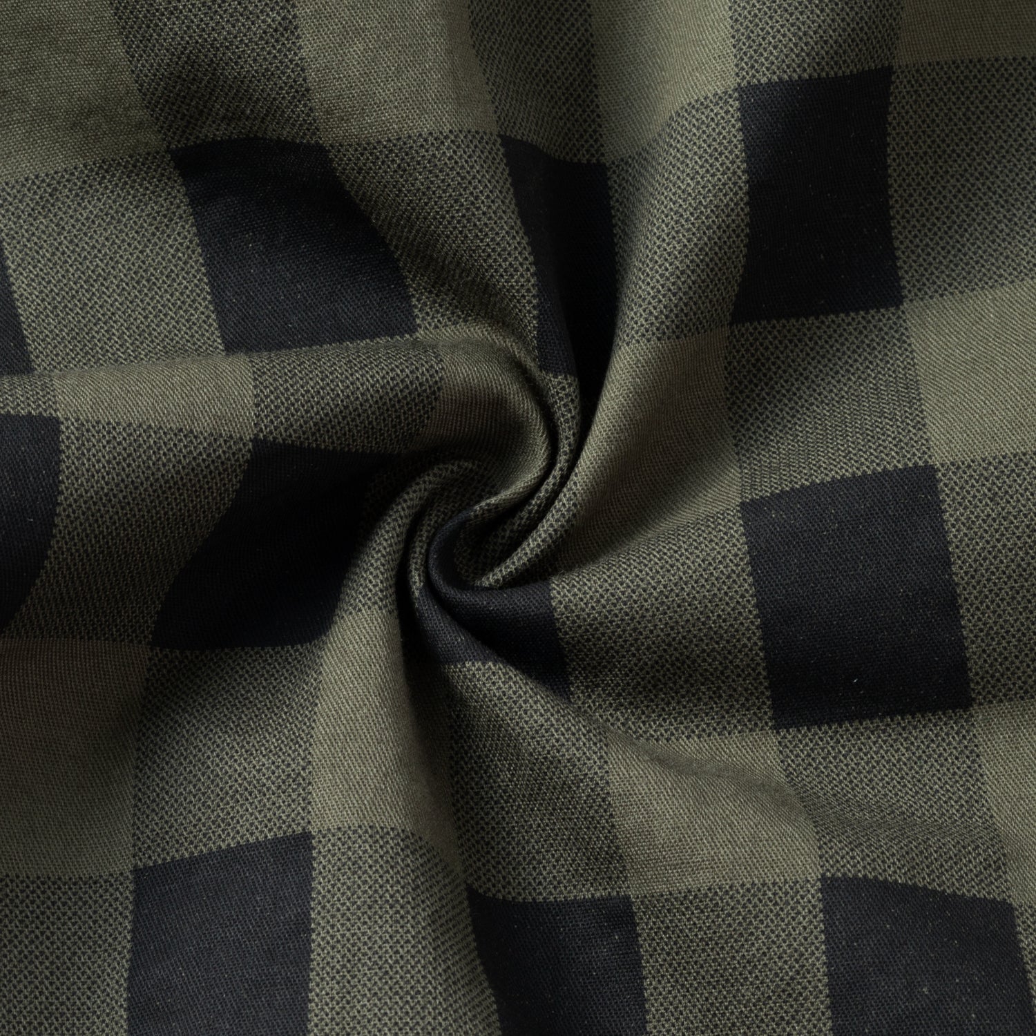 Close-up of green and black plaid high-performance outdoor apparel fabric, FREDD MARSHALL